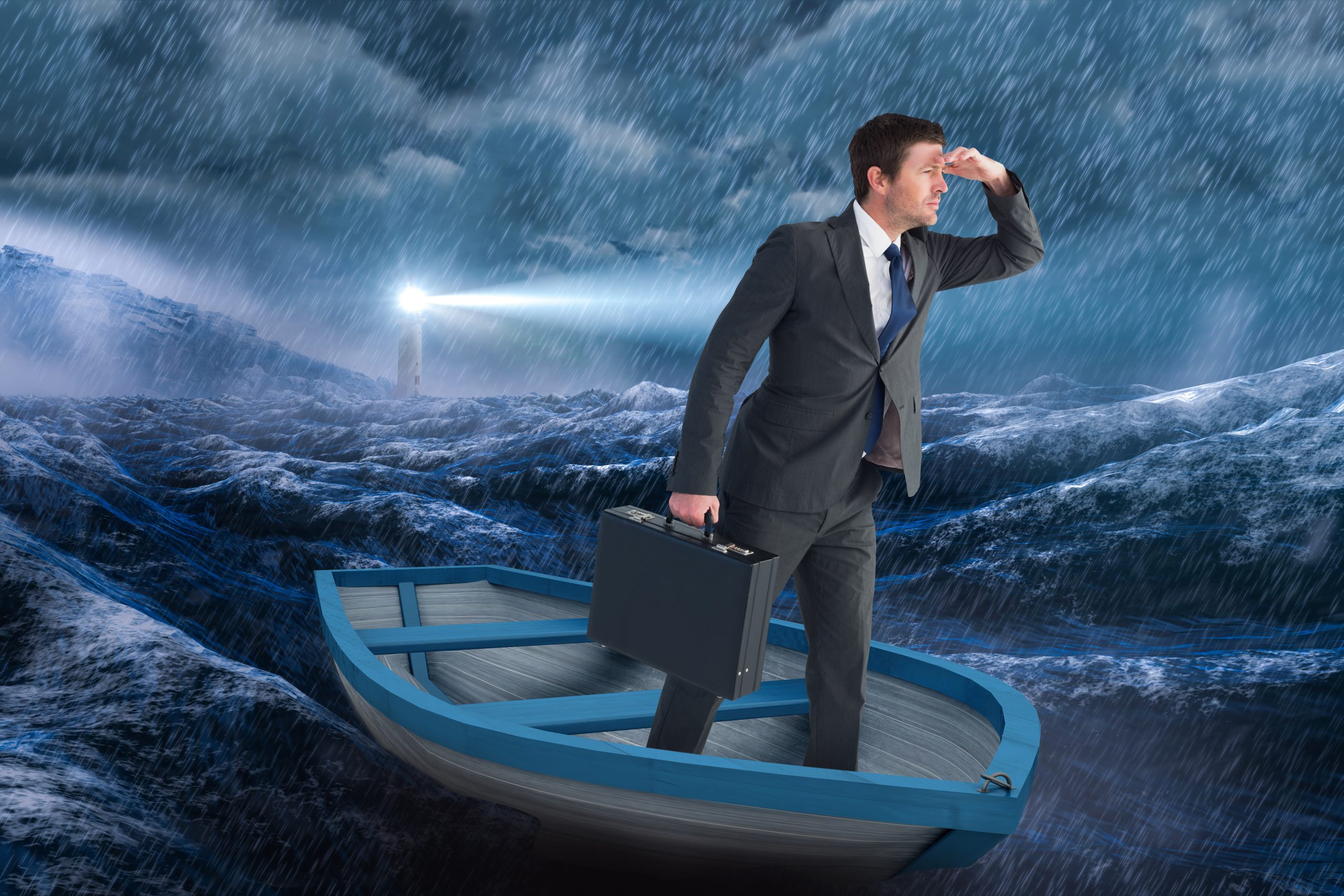 Man standing in boat on rough seas, looking for a light.